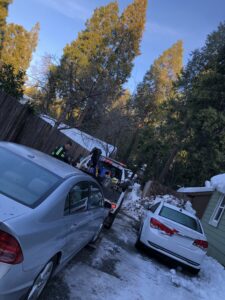 My car being hooked up to be towed out of the snow and ice