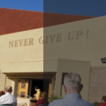 Photo of my church with the words "Never Give Up" on the outside of it